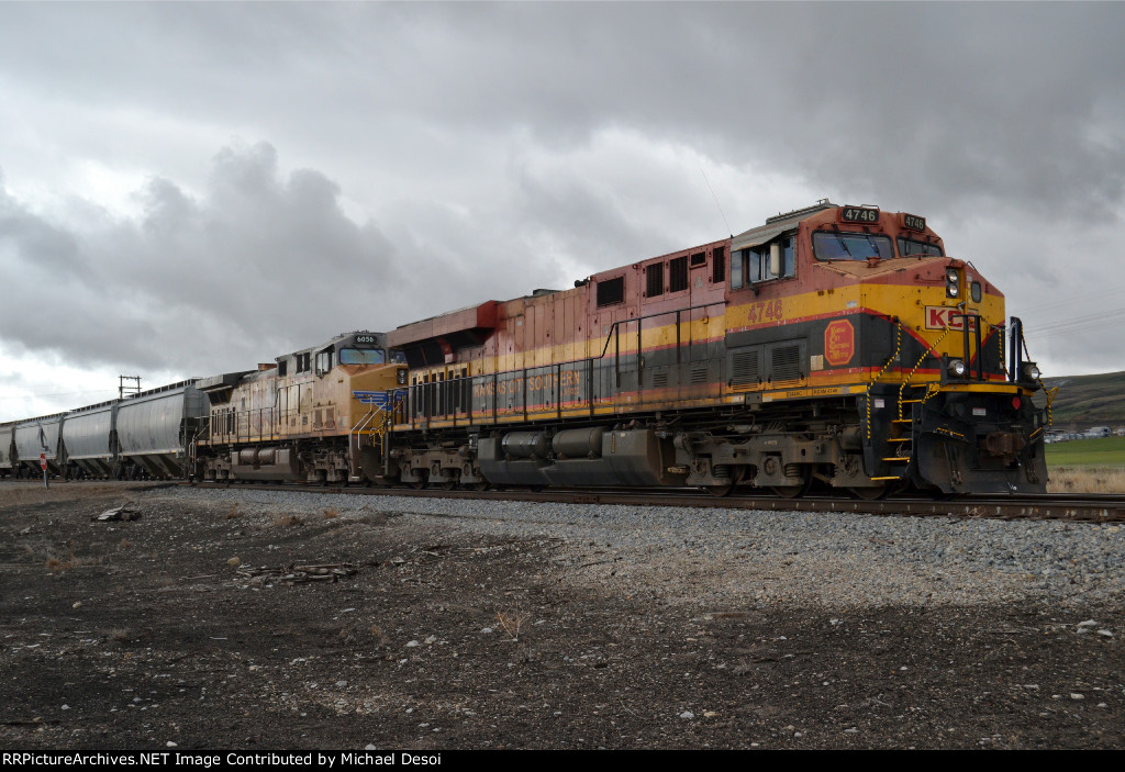 KCSM 4746, UP 6056 (ES44AC, AC4400CW) are the rear DPUs on a northbound UP (empty?) grain train at Cache Junction, Utah. April 15, 2022